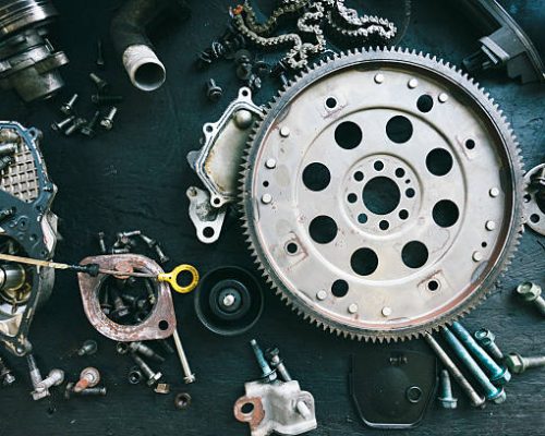 Car parts displayed on a workbench